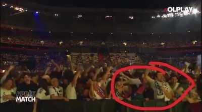 Soccer fan takes advantage of a stadium elation to repeatedly elbow a woman next to him 