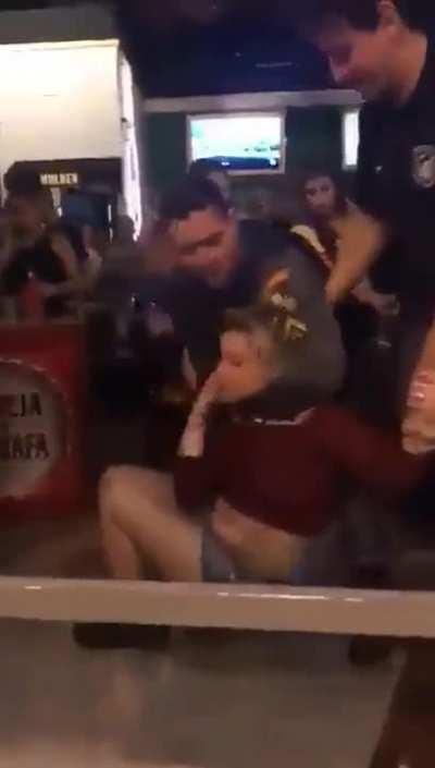 When you play a stupid game called “Let’s throw a glass full of liquid at a Brazilian Officer”