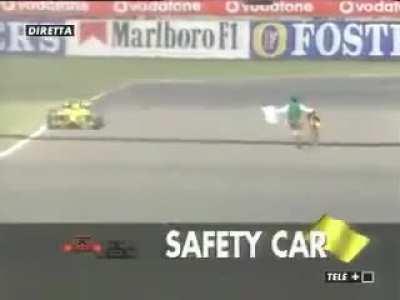 Guy runs onto F1 track during a race!