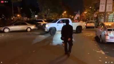 Progressive/anarcho-Democrats steal large American flag from right-wing driver's truck, attempt to steal his license plate