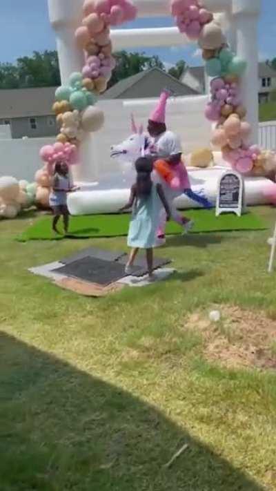 Grandpa dress up as a unicorn for his granddaughter's party.