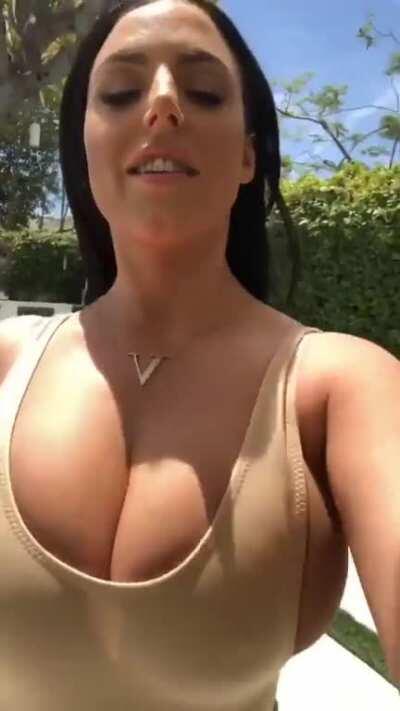 Angela walks for us again. Her top can hardly hold her breasts in.