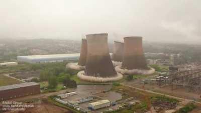 Demolishing four 117m (384ft) cooling towers today at a closed power station in Staffordshire, England