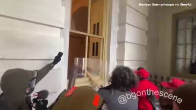 January 6th 2021. Trump supporters use a stolen police riot shield to break into the Unites States Capitol with the intention of halting the certification of the Presidential election.