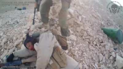 A Russian PMC finishes off two ISIS fighters and then is wounded by a grenade