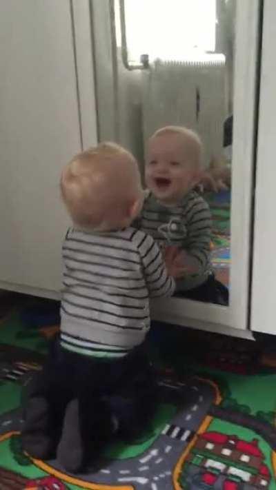 Kid figures out how mirrors work.. The hard way.