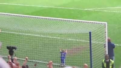 Crowd cheers as child scores