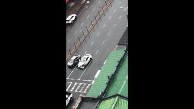 In South Africa a group of armed criminals stop at an accident scene and rob the victims, then as they speed off they shoot at a responding ambulance, nearly missing the drivers head, it's said. (Video from bystander and dashcam in ambulance)