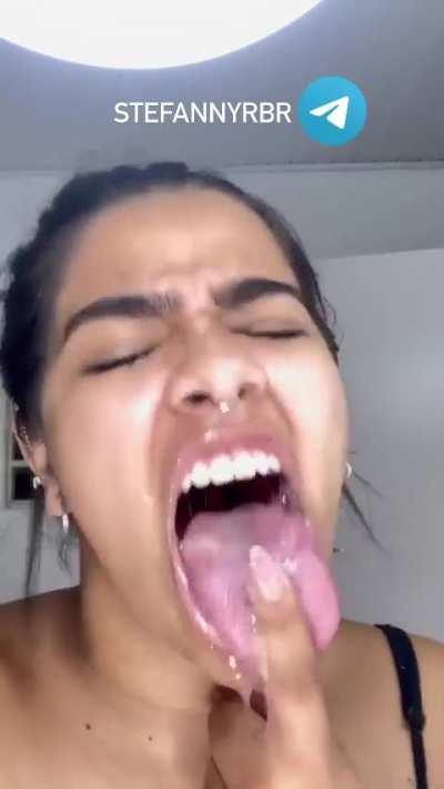 Licking fingers with long tongue