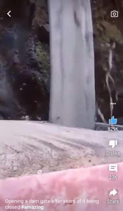 Opening a dam gate after years of it being closed