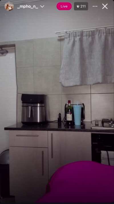 (@_mpho_n_) wearing a see-through dress on IG Live 9/23/25