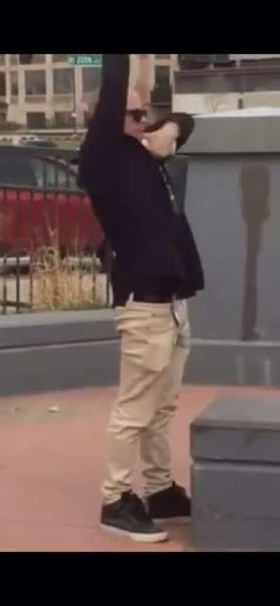 Guy huffing keyboard cleaner at a skatepark