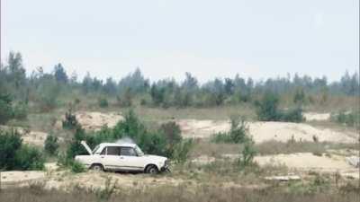 A 152mm shell bounces off of a car roof.