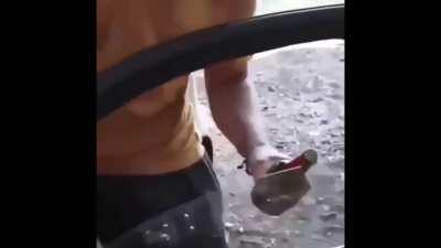 WCGO trying to open a bottle using a glass window