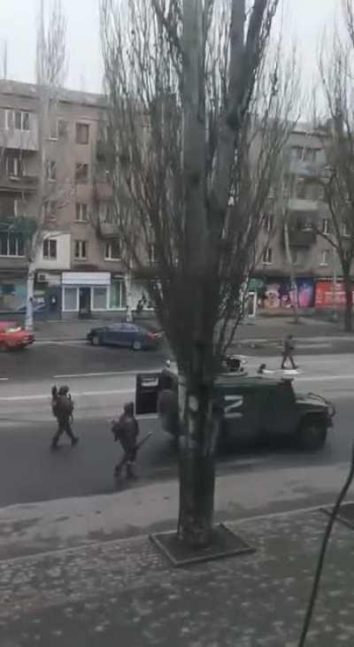 A GAZ Tigr along with Russian soldiers clearing the streets of Melitopol.