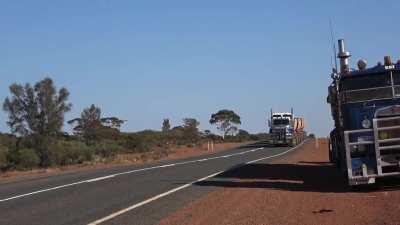 Hauling gold ore from mine to treatment plant in Australia, 86 wheels, 4 trailers, 175 tons!