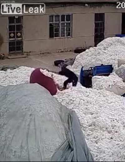 Using a lighter to open plastic bags at a COTTON WAREHOUSE...