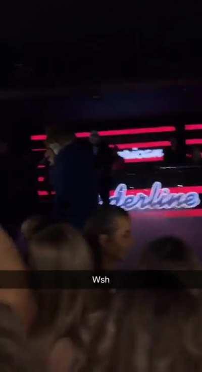 Girl gargles on the Joker’s mike at the club