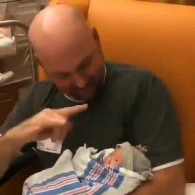 Deaf Father signing to his newborn daughter about how much he loves her