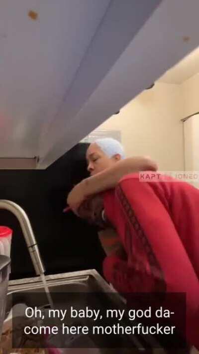 Never mess with a mom washing dishes