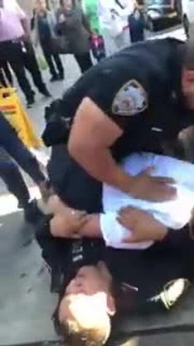 NYPD officer landing repeated blows to a person they are detaining when they are not resisting