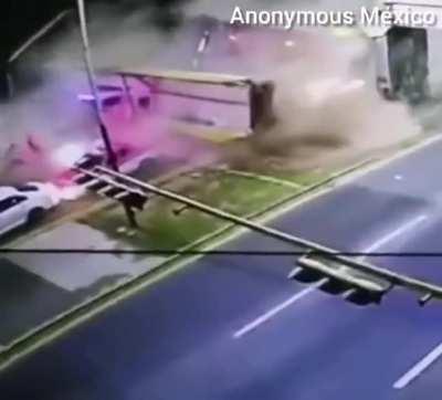 Pedestrian overpass struck by semi-trailer collapses onto cars below