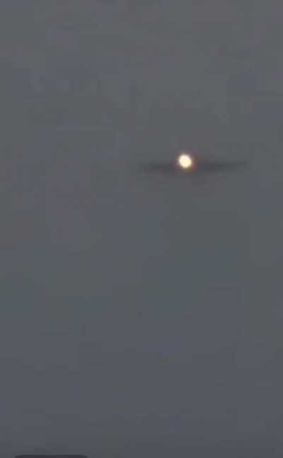 USN F/A-18 landing on a carrier during bad weather