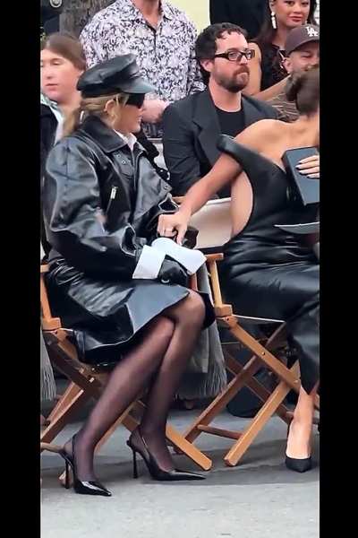 Miley in blk leather and hose.