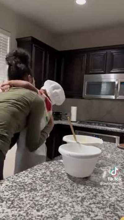 Kid is really appreciative of his mom baking cookies