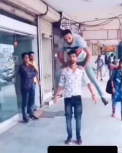 By trying to jump over your friend in tight jeans