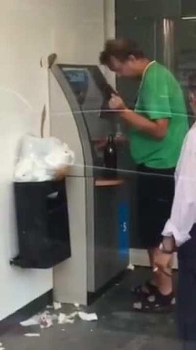 Trying to use the ATM.....drunk AF.