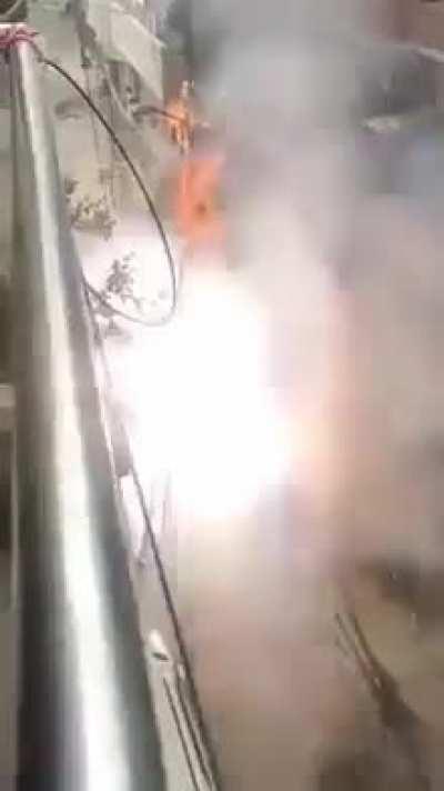 A metal balcony with wires strung from it possibly connected to that mess? 💀🚩