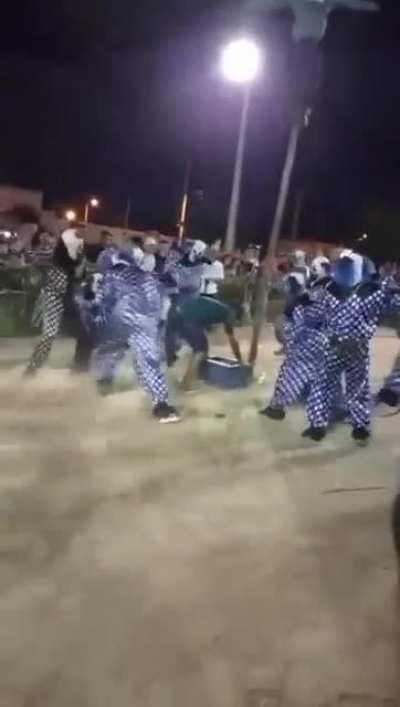 This man enduring pain for a crate of beer.