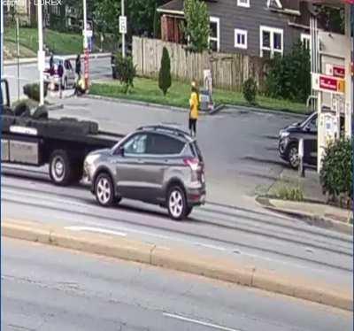 Driver slowly runs over a guy