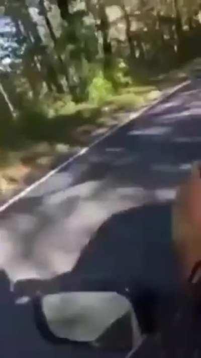 Man uses car as skateboard