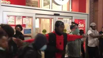 Protestors protect a Target from looters
