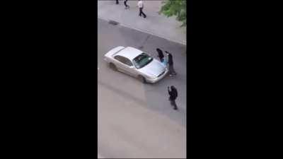 Angry mob of protesters forcing driver to run them over