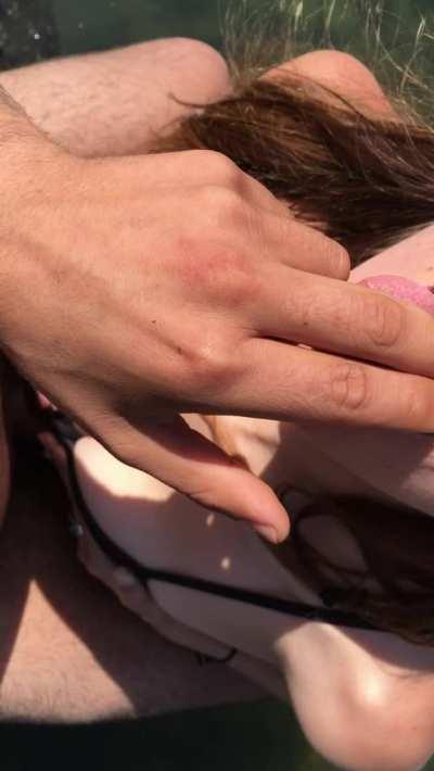 Amateur couple titty fucking in a public tide pool