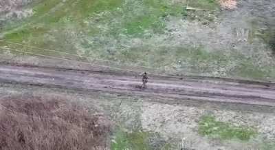 A Ukrainian drone strikes a fleeing Russian soldier, propelling him forward with force. Video from Robert Magyar.
