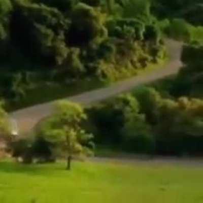 Just a car driving down a road