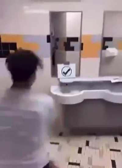Kid destroys a sink.