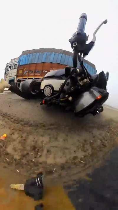 Performing motorcycle stunt in close proximity to a moving truck