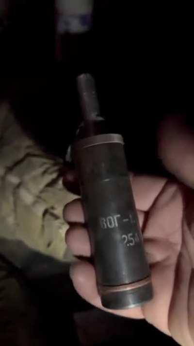 James Vasquez with an ancient hand made soviet grenade. The enemy is running low on munitions and has resorted to pulling such relics out of stores.