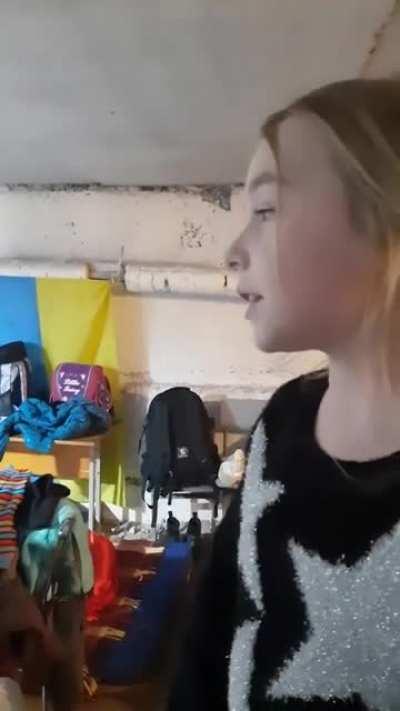 A girl sing a song in a shelter