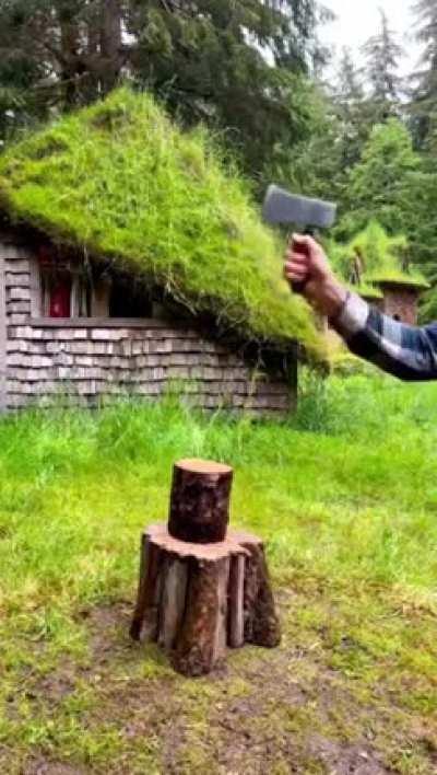 This man showing his various axe designs.