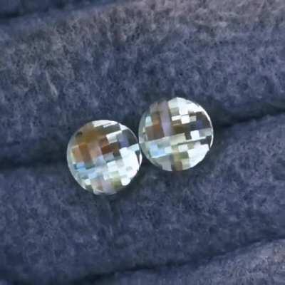 A pair of round pixel cuts in prasiolite that I cut for a pair of earrings