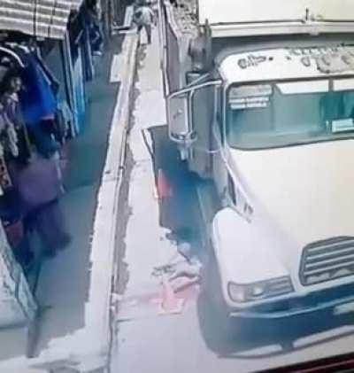 Man gives thumbs up while walking in the road