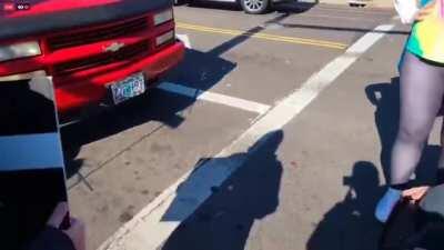 Liberal/progressive BLM protestors surround car, harass driver with conservative flags