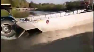 Driving a tractor off a ferry that isn't properly moored