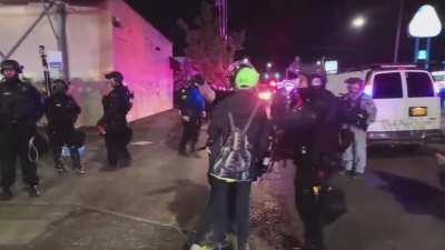 Woman brings her kid to Portland protest after riot has been declared multiple times - day 74